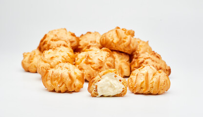 Delicious cream-filled profiteroles, golden and crisp, perfect for a sweet dessert treat