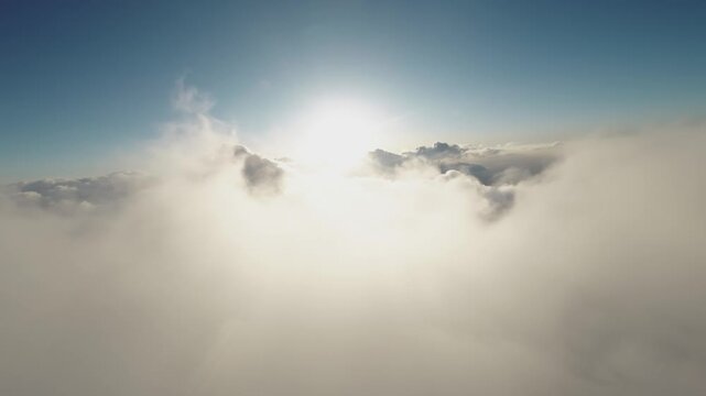 Sunset Aerial fpv view Real flight in the clouds first-person view from the cockpit. Cloud surfing in sunny weather. Aerial view flying through the clouds