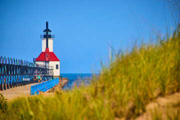 Benton Harbor Lighthouse on Pier with Red Roof Tall Grass Foreground