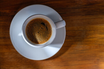 A cup of coffee on wooden table