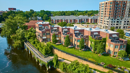 Aerial Fly Through Modern Riverside Townhouses and Riverfront Boardwalk