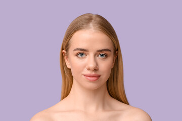 Young woman with beautiful lips on lilac background