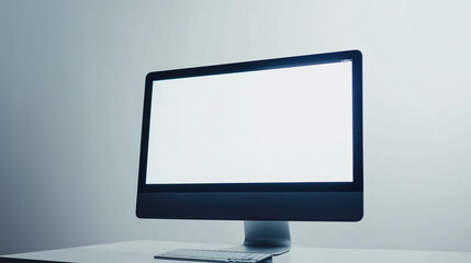 Fototapeta premium Desktop computer with a blank white screen placed on a minimalistic white desk, set against a plain light background, giving a modern and clean appearance.