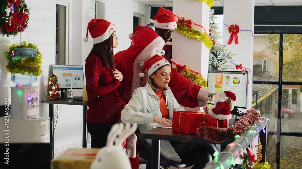 Wall mural manager dressed as santa claus in xmas ornate office supervising company tasks after offering gifts 