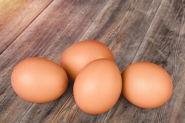 Stack of fresh tasty chicken egg on desk