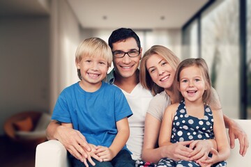 Happy young family relaxing at home