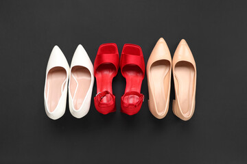 Female shoes on black background. Top view