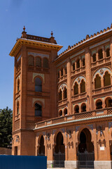 Las Ventas bullring, Madrid, Bull square. Plaza de toros. Events and traditions of Spain. Red sand under a burning sun. No people. Fight between matador and bull. Blood, passion, dance, celebration.