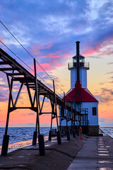 Lake Michigan Lighthouse at Sunset from Pier Perspective