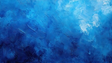 Obraz premium A textured blue abstract background with varying shades and strokes.