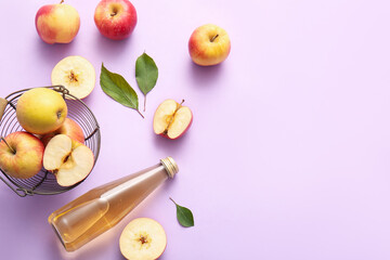 Composition with fruits, bowl and bottle of fresh apple cider on lilac background