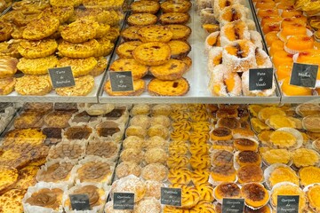 A variety of fresh and delicious pastries displayed is displayed in Lisbon, Portugal