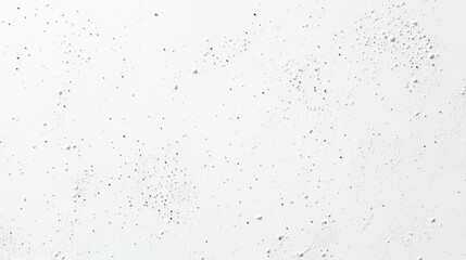 Naklejka premium A textured white surface with small black specks, resembling a wall or background material.