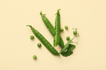 Green peas on beige background