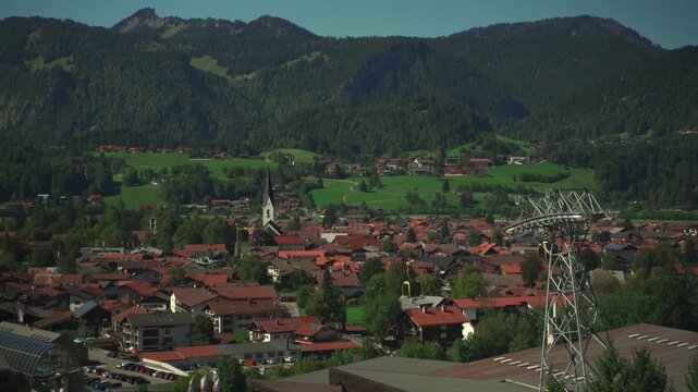 Nebelhornbahn. Allgau, Oberstdorf, Germany. Cable car to the high mountain in Bavaria in city of Oberstdorf. Gondola cabins move on sunny day in Bavarian alps. Bergbahn am Nebelhorn. 