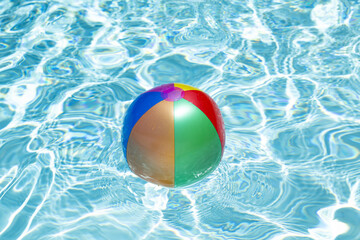 Summer vacation. Beach ball. Summer party. Inflatable beach ball. Striped ball for play in water.