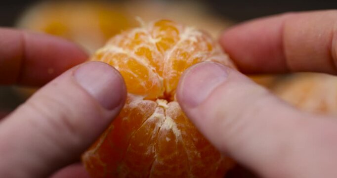 peeled ripe sweet tangerine, mandarin fruit without shell on a wooden blackboard