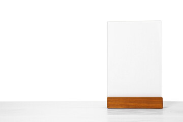 Menu holder on light wooden table against white background. Space for text