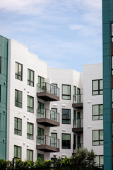 Exterior view of modern apartment building. New construction apartment or condo complex. Modern new residential apartment house building complex