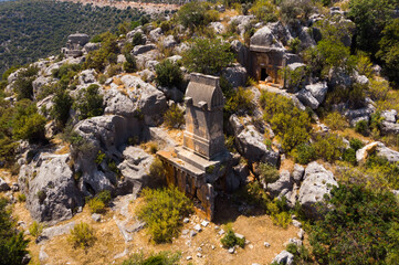 Rock tombs, tombstones and sarcophagi on a mountainside near the ancient city of Sura. Turkey