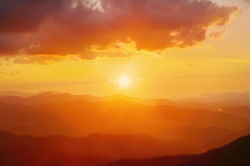 Obraz premium Mountain landscape at sunset with warm colors and misty atmosphere