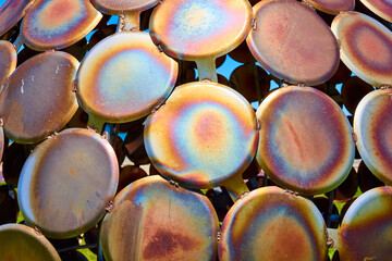 Iridescent Metal Plates Close-Up with Visible Welds