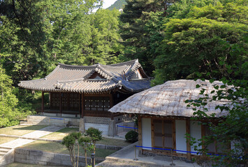 Jongno-gu, Seoul, South Korea - May 14, 2022: Spring view of Chimryukak Pavilion and a thatched house at Blue House in spring