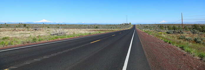 US Highway 26 traveling west from central Oregon towards the Cascade Mountains with Mt Hood on the...