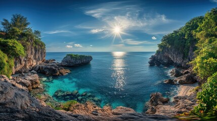 A secluded bay in Phuket at midday, with the sun shining brightly from a clear blue sky