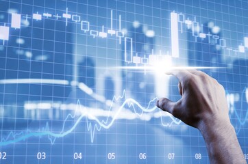 Investing and stock concept. Hand and data charts