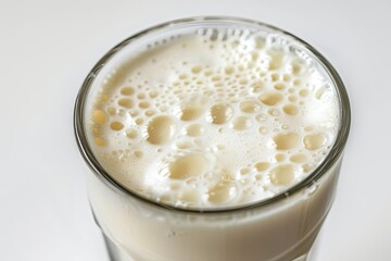 A glass of Ayran (Airan) close up isolated on white 