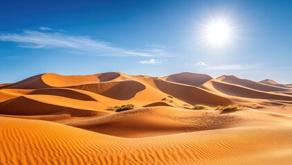Sunlight Illuminating Golden Sand Dunes of the Sahara Desert, Wide Shot of Sunlit Dunes and Clear Blue Sky Landscape Background