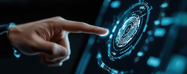 A hand pointing at a blue circle on a screen