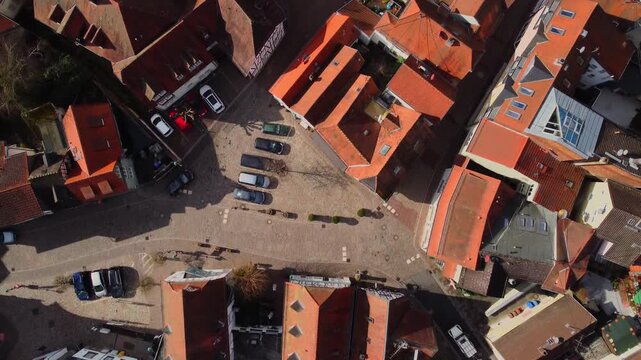Drone footage of Eppstein Castle and medieval old town in Germany at sunrise. The serene morning light highlights historic architecture of castle and medieval town of Europe. Shots: Top Down Bird View
