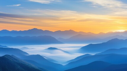 Obraz premium Expansive mountain vista with layers of fog rolling through valleys under a golden sunrise