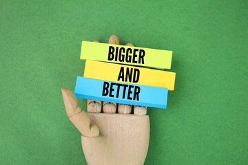 colored paper with the words bigger and better
