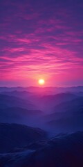 Fototapeta premium A breathtaking sunrise paints the sky with vibrant hues of pink and purple as the sun peeks over a distant mountain range.