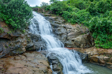Fototapeta premium A waterfall during the monsoons near Pune India. Monsoon is the annual rainy season in India from June to September.