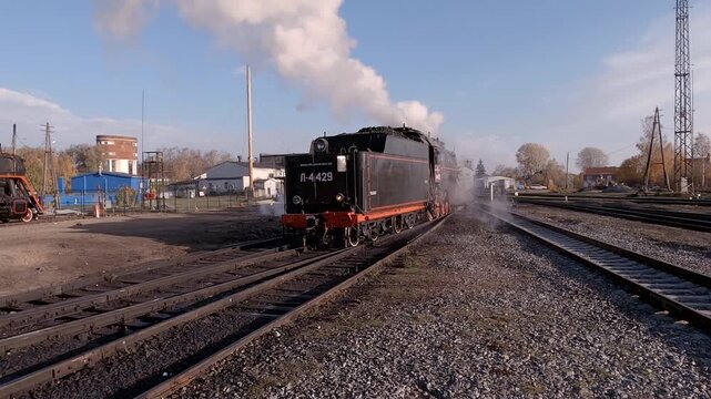 Old Soviet steam locomotive on an October morning, Karelia, Russia