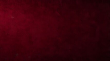 Fototapeta premium Deep red textured background suitable for dramatic designs, festive themes, romantic concepts, fashion editorials, and bold branding projects.
