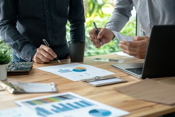 A team analyzing previous social media posts’ performance and discussing improvements for future content