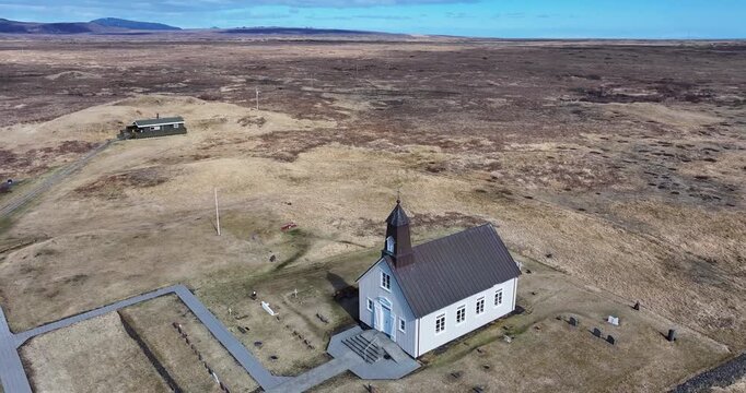 Strandarkirkja church stood sentinel over the turbulent ocean, its ancient stones bearing witness to the untamed beauty of Iceland's south coast.