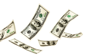 Flying dollar bills on white background.