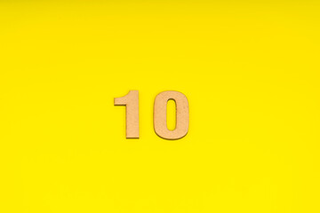 Number ten in leather on yellow background