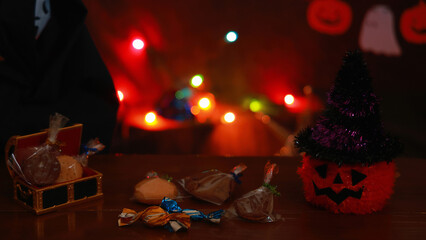 A pumpkin ghost lantern and a Grim Reaper doll: illuminated Halloween decorations