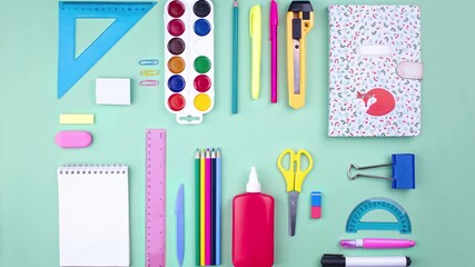 Flay lay top view layout of school supplies on the table. Pastel colors. Back to school concept loop stop motion animation 4k pastel colors - Powered by Adobe