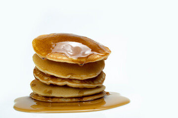 A stack of pancakes with syrup on top