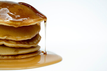A stack of pancakes with syrup on top