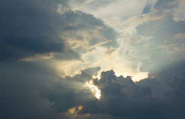 This is a landscape with sunlight shining through the clouds.
