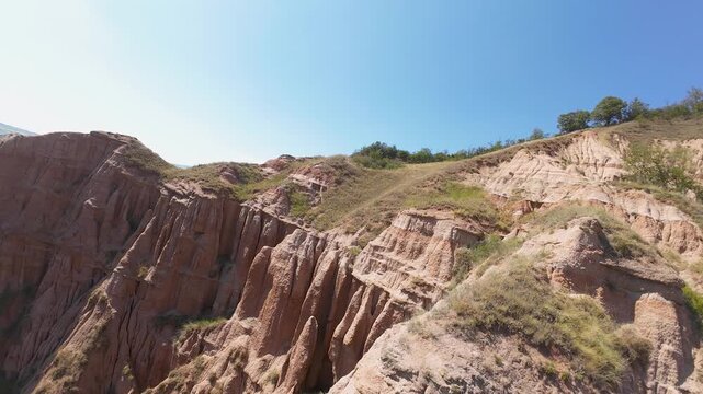 Fpv drone shot of Panorama of the Red Ravine Rapa Rosie in Romania